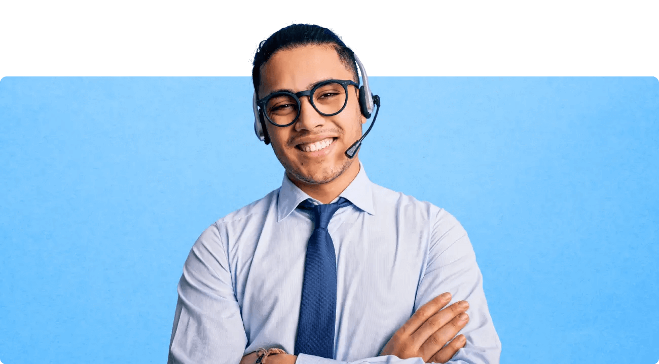 A happy, remote customer service agent in a headset and tie.